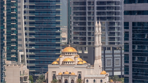 Dubai Marina skyline with Mohammad Bin Ahmed Al Mulla mosque aerial timelapse