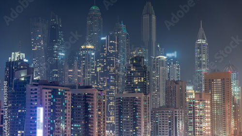 Dubai marina tallest block of skyscrapers night timelapse. © neiezhmakov