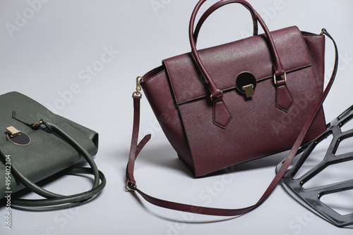 woman leather bag composition on white background