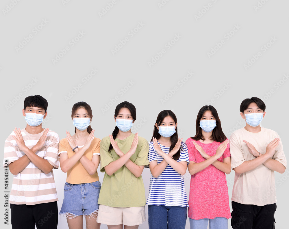 young people wearing face masks during covid-19 pandemic .Group of teenagers with deny gestures young people wearing face masks during covid-19 pandemic .Group of teenagers with deny gestures