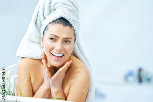 Young nice brunette woman in the bathroom