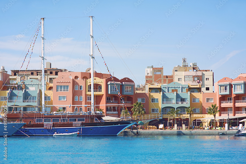 Obraz premium yachts and boats in the port town by the sea in summer. Travel, recreation, environment concept