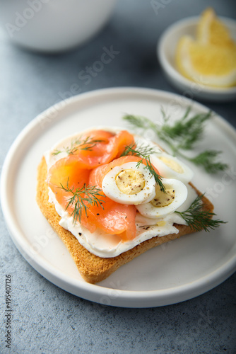 Salmon toast with quail eggs and dill