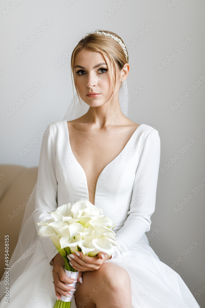 The bride is holding a bouquet in her hands The bride is holding a bouquet in her hands