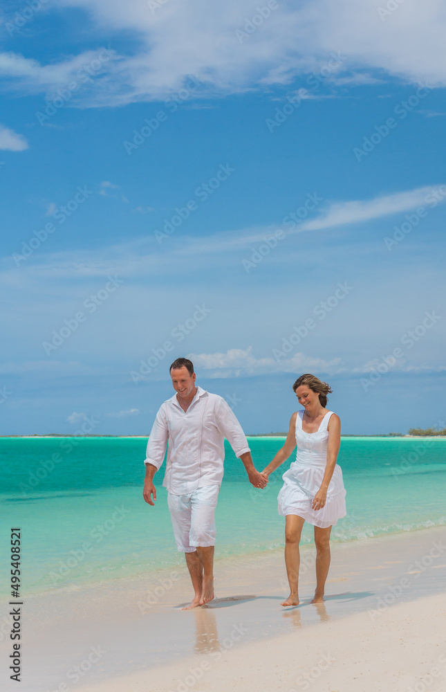 Healthy Caucasian couple walking by sea on holiday Healthy Caucasian couple walking by sea on holiday