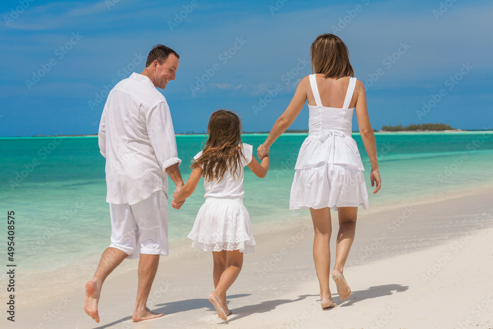Happy family with daughter summer beach resort outdoors