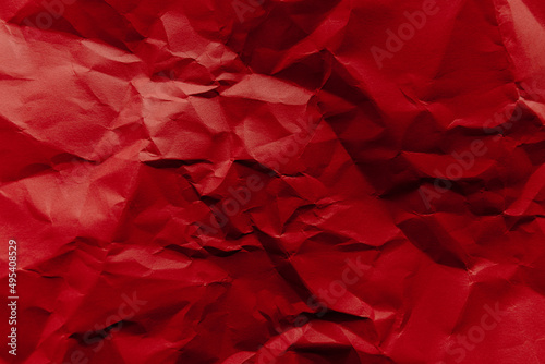 The crumpled red paper texture. 