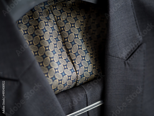 Obraz na plátne Close up of dark grey jacket with colorful lining