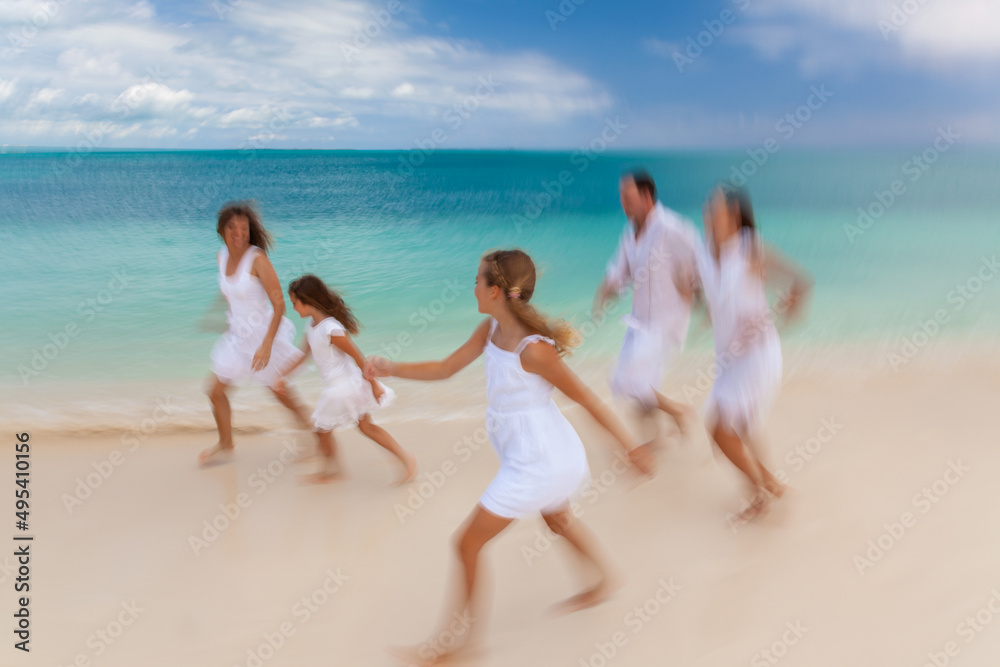Young Caucasian family having fun by tropical ocean Young Caucasian family having fun by tropical ocean