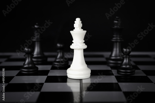 chess game.business leader concept.Selective focus.on a dark background.