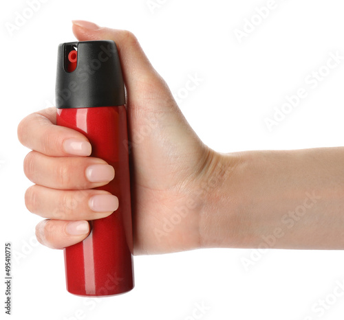 Woman with bottle of gas pepper spray on white background