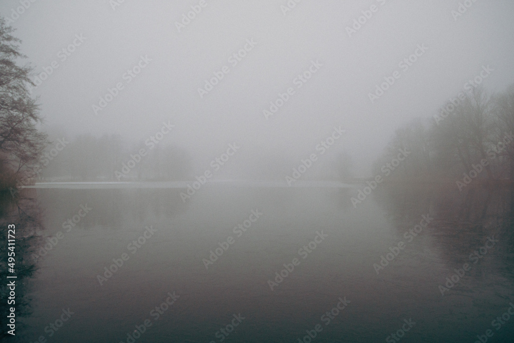 lake with forest in the background, big fog lake with forest in the background, big fog
