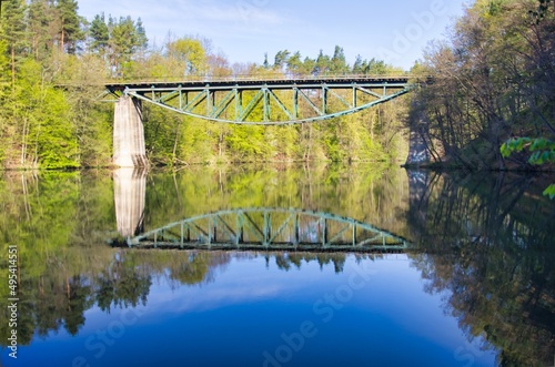 Rail bridge in the spring calm morning - reflection in the water