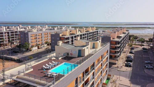 Aerial view of the urban area of portugal in the south of houses with modern infrastructure swimming pools overlooking the sea. Southern city of Portugal Olhao.