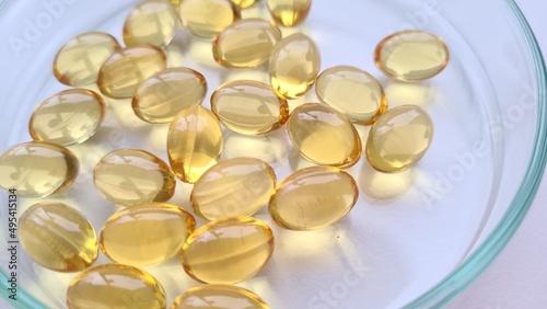Omega 3 fatty acids capsules and vitamins closeup