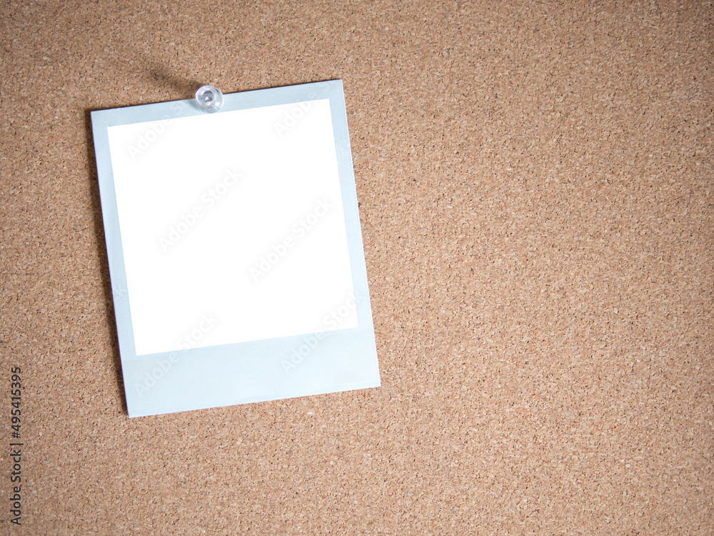 Fototapeta premium Blank white photo card template on cork board background for photo