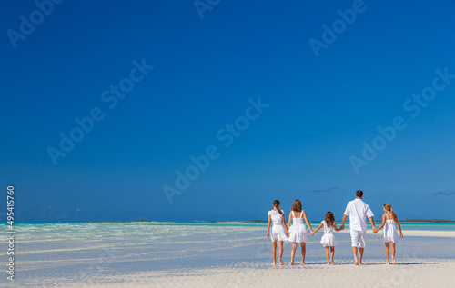 Healthy Caucasian family together on beach vacation Caribbean