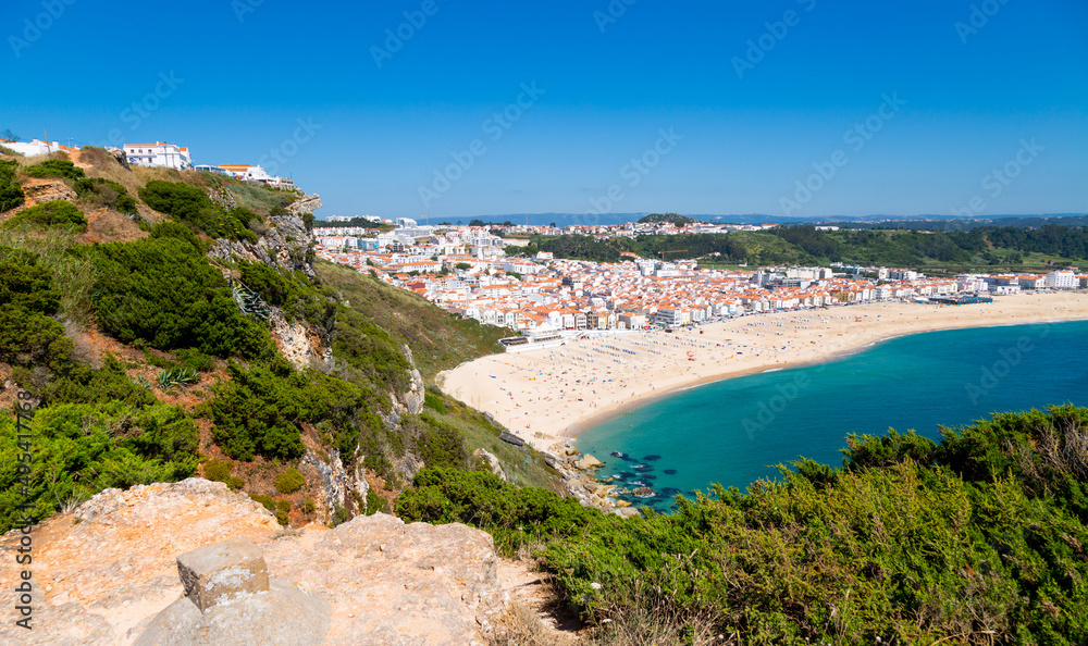 View of Nazaré town and beach in Portugal in a summer day