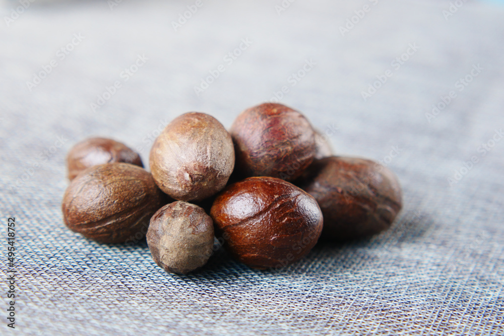 Obraz premium Ground nutmeg on table close up ,