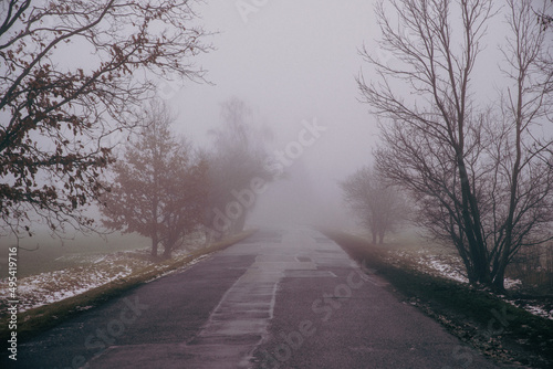 asphalt road in the fog, vintage effect