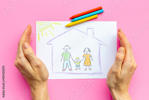 Childs drawing of happy family. Adoption concept