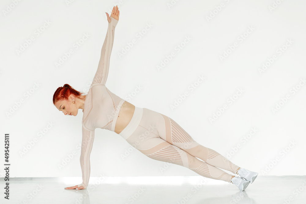 Athletic girl fitness trainer is training in the studio Athletic girl fitness trainer is training in the studio