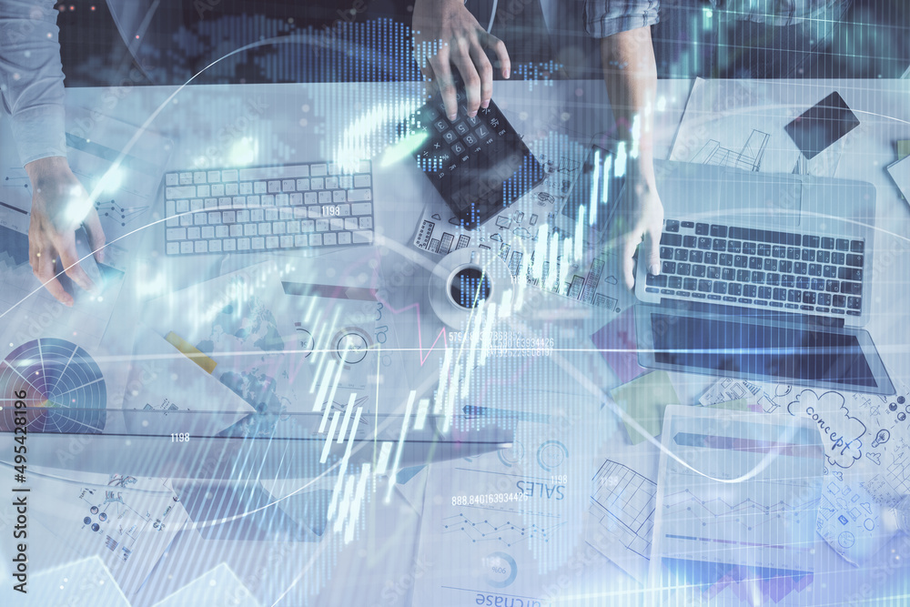 Multi exposure of man and woman working together and financial chart hologram. Business concept. Computer background. Multi exposure of man and woman working together and financial chart hologram. Business concept. Computer background.