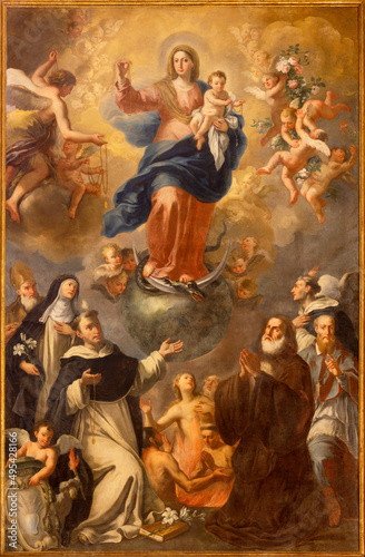 MONOPOLI, ITALY - MARCH 5, 2022: The baroque painting of Madonna of rosary among the saints in Cathedral - Basilica di Maria Santissima della Madia by unknown artist.
