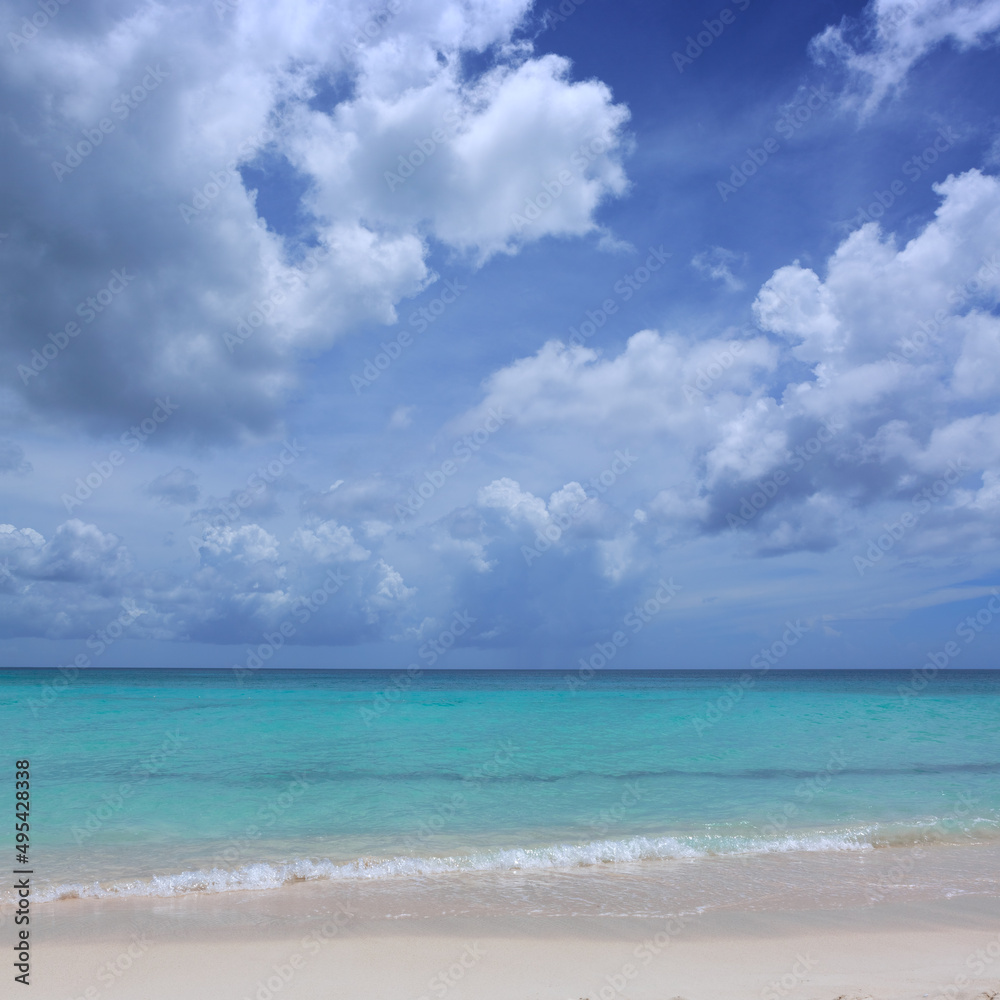 Travel background with clouds sky and Caribbean sea.