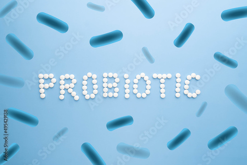 Probiotic supplement pills with lactobacillus bacteria to help support digestion, immune system and gastrointestinal tract. Good gut health concept.