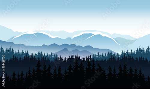 snowy mountains with forest silhouettes and cold misty weather