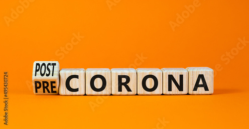 Covid-19 post or pre corona symbol. Turned wooden cubes and changed concept words Pre corona to Post corona. Beautiful orange background. Covid-19 pandemic post or pre corona concept. Copy space. photo