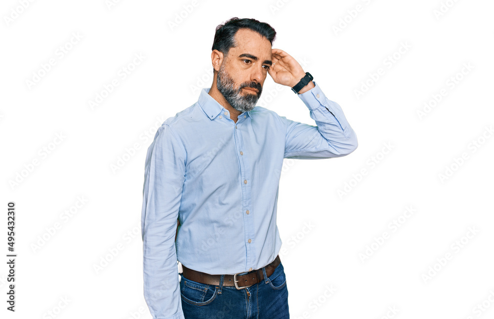 Middle aged man with beard wearing business shirt confuse and wondering about question. uncertain with doubt, thinking with hand on head. pensive concept. Middle aged man with beard wearing business shirt confuse and wondering about question. uncertain with doubt, thinking with hand on head. pensive concept.