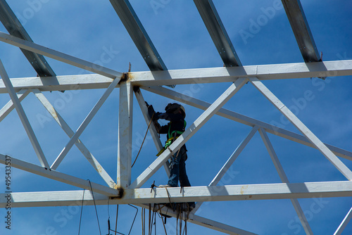 Industrial construction site, builder profession background. High-rise metal frame