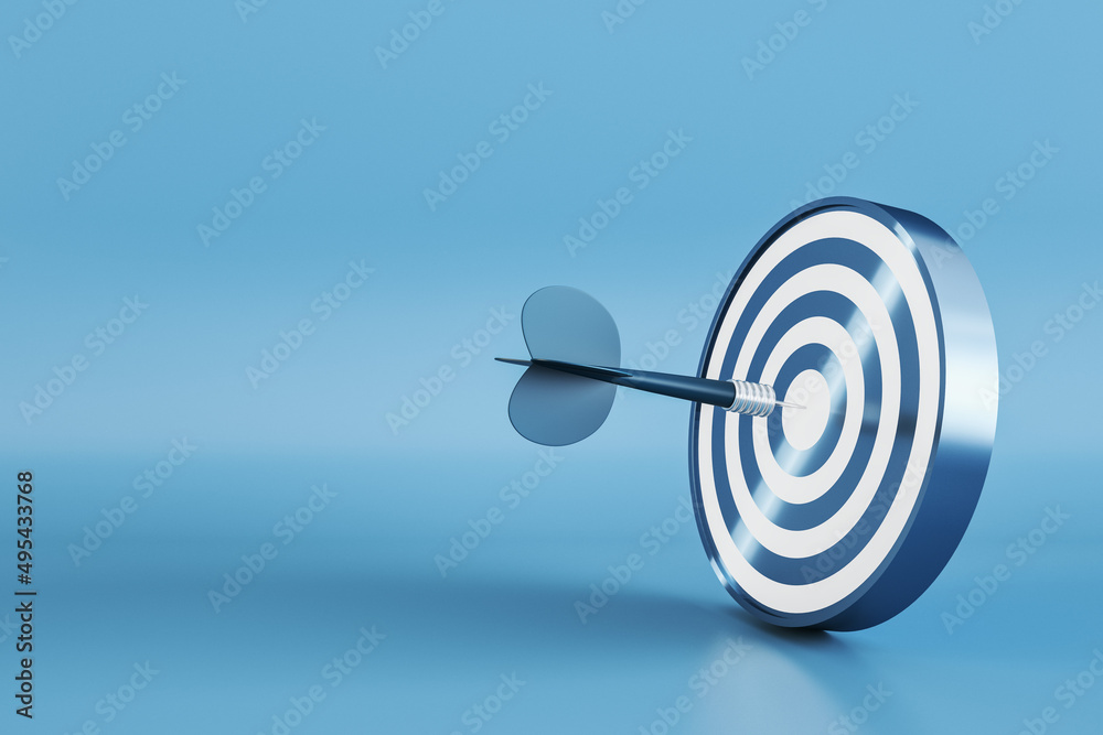 Creative bullseye target with arrow on blue background with mock up