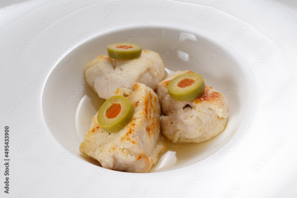 Chicken meat with green olives