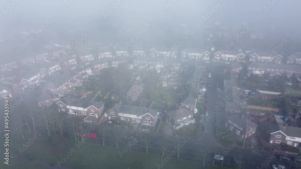 Thick fog cover over British residential townhouse neighbourhood aerial view Thick fog cover over British residential townhouse neighbourhood aerial view