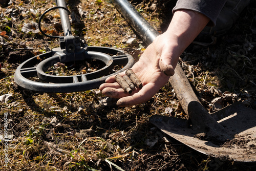 search for shells and cartridges of the Second World War with metal detector photo