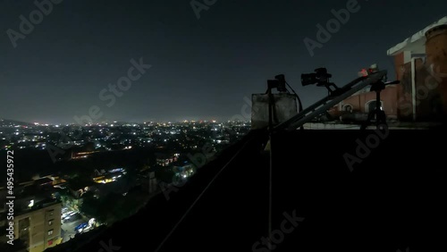 This timelapse captures a moving camera recording the overlooking city lights of Guwahati, Assam at night.  photo