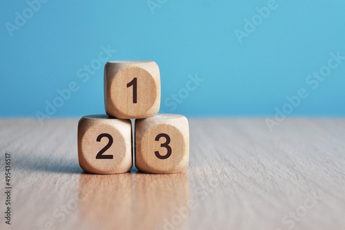 Cubes with numbers: 1,2,3. The order of priority in any activity is correct photo