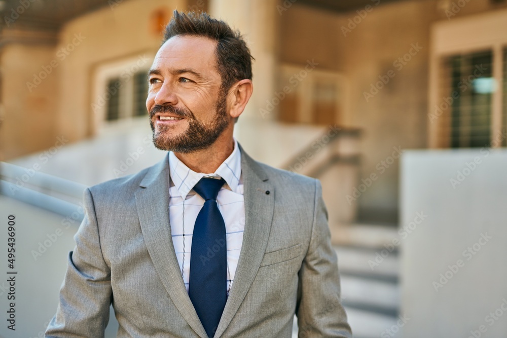 Middle age businessman smiling happy standing at the city. Middle age businessman smiling happy standing at the city.