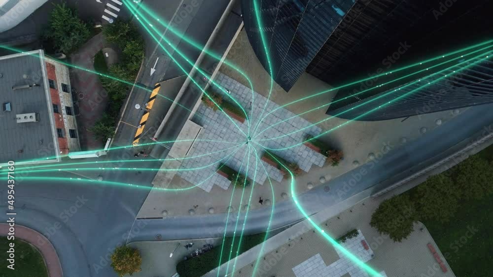 Big City Businesswoman Uses Laptop Computer in Urban Park. E-Commerce Visualization of Information Lines Flying from Laptop into Global Online Network. Top-Down Zoom Out Aerial Drone Shot.