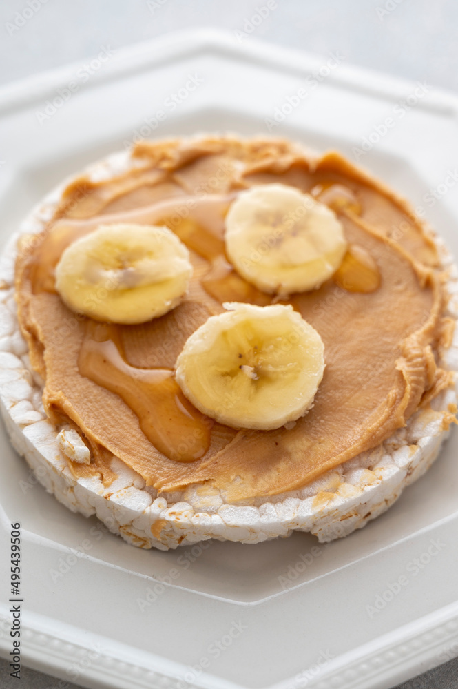 Peanut butter over rice cakes and honey. Healthy protein snack for breakfast Peanut butter over rice cakes and honey. Healthy protein snack for breakfast