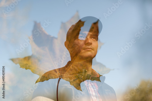 Double exposure of East Asian man and yellow flower photo
