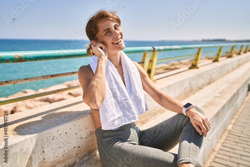 Young caucasian woman wearing sportswear resting at seaside © Krakenimages.com