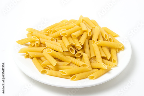 Dry pasta on a white background. Large pasta. Traditional food