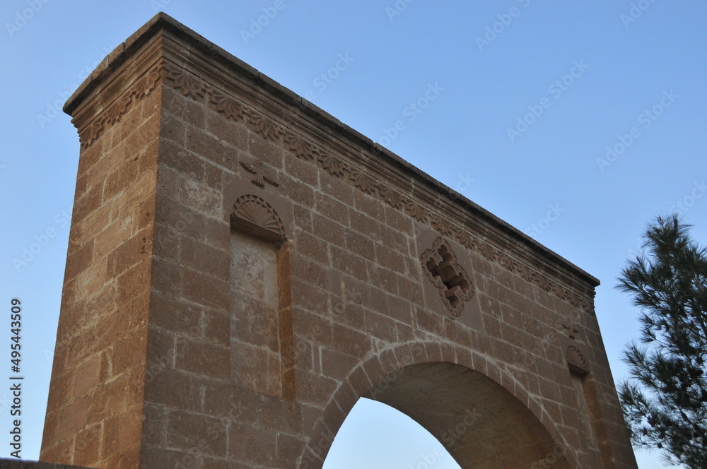 old church stone gate with cross, ancient church stone arch, old church architecture