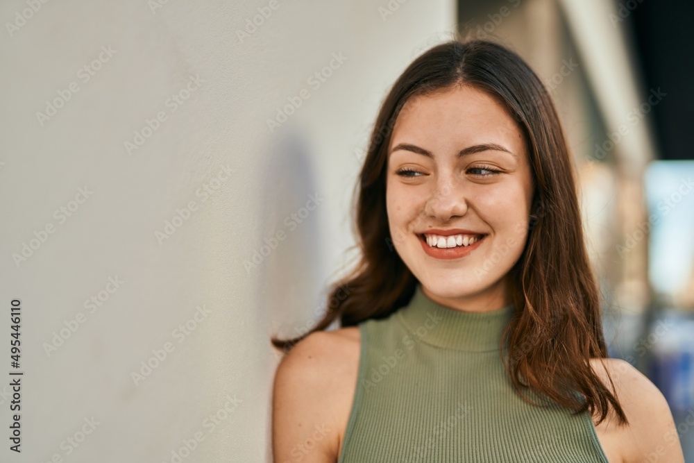 Young caucasian girl smiling happy standing at the city. Young caucasian girl smiling happy standing at the city.