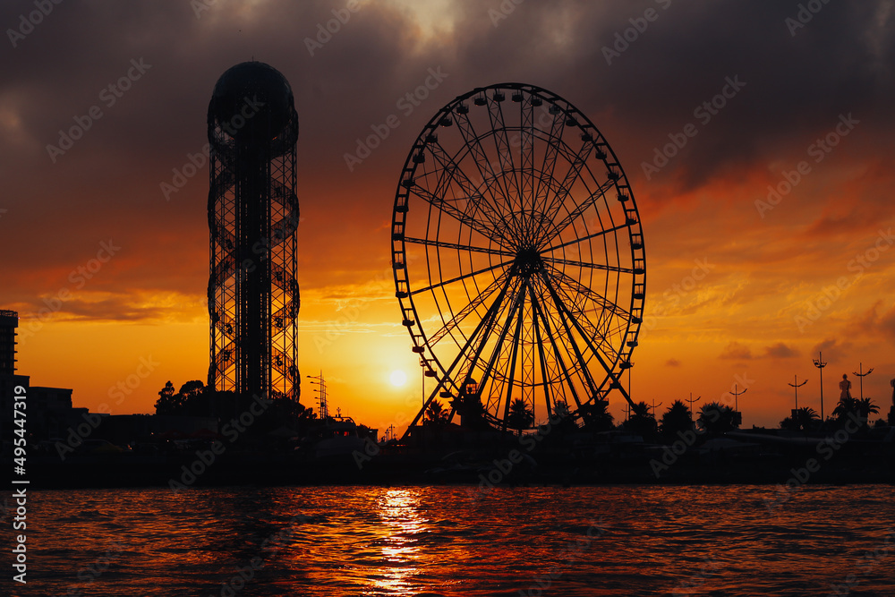 Ferris wheel at sunset near the sea in Batumi. High quality photo