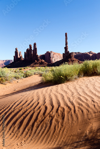 Vertical view of rippled dunes and red sandstone thin rocks seen during a sunny day, Monument Valley Navajo Tribal Park, Utah, USA photo